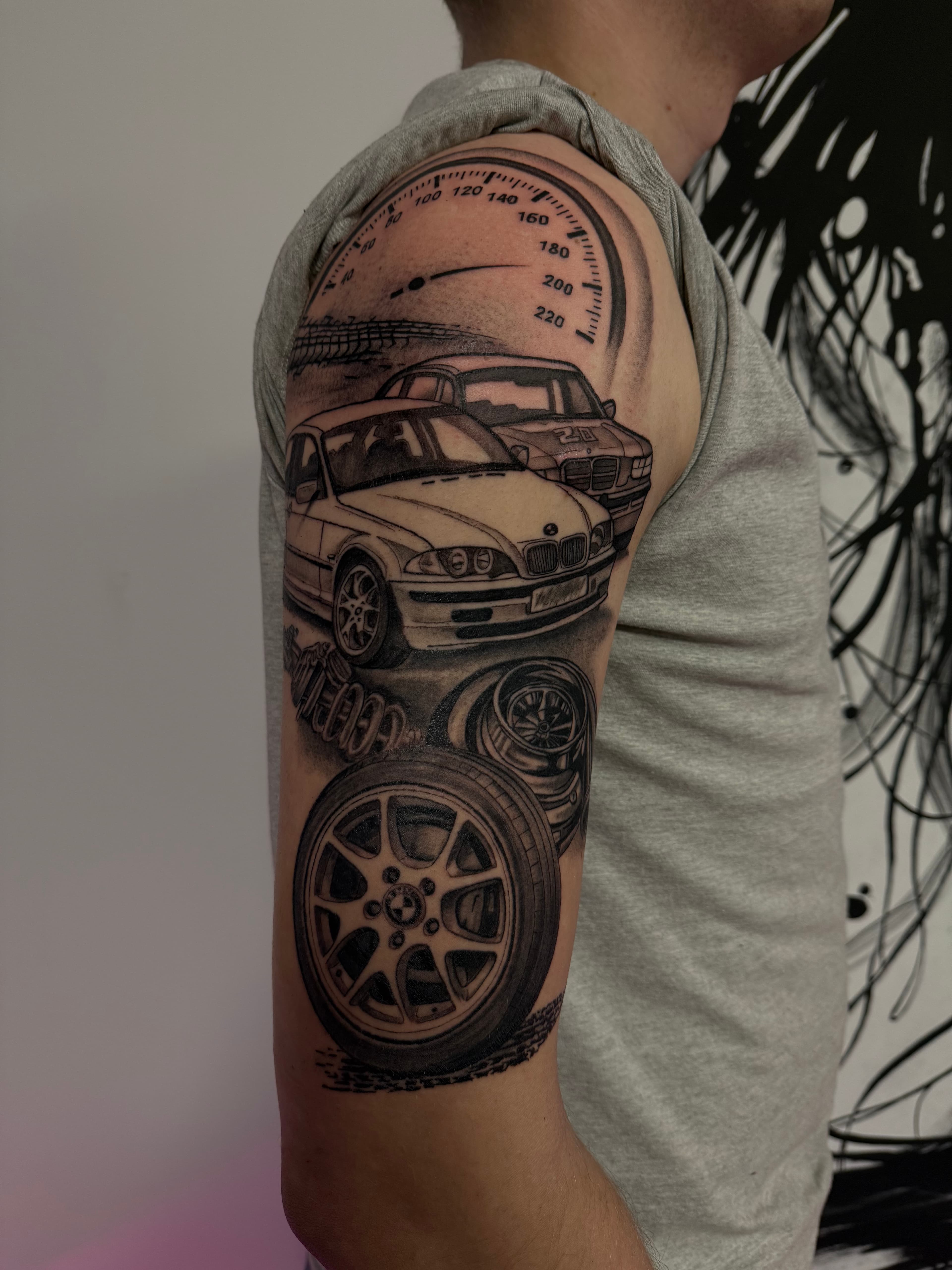 Black ink tattoo with geometric elements by Mariana