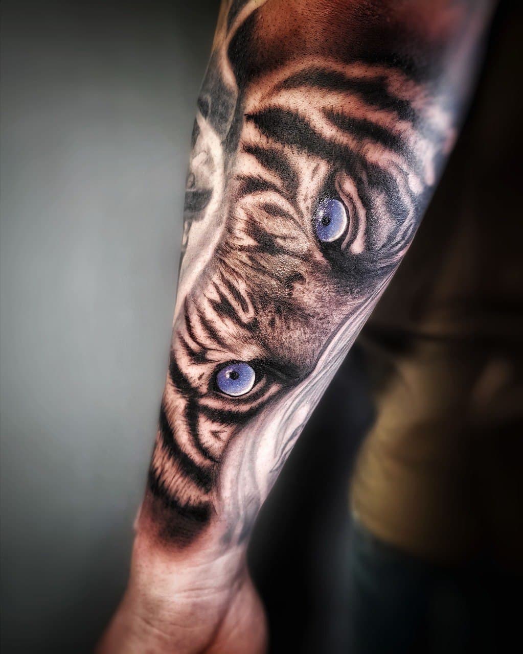 Detailed Black and Grey tiger tattoo by Mariana Tkachuk in Gdańsk