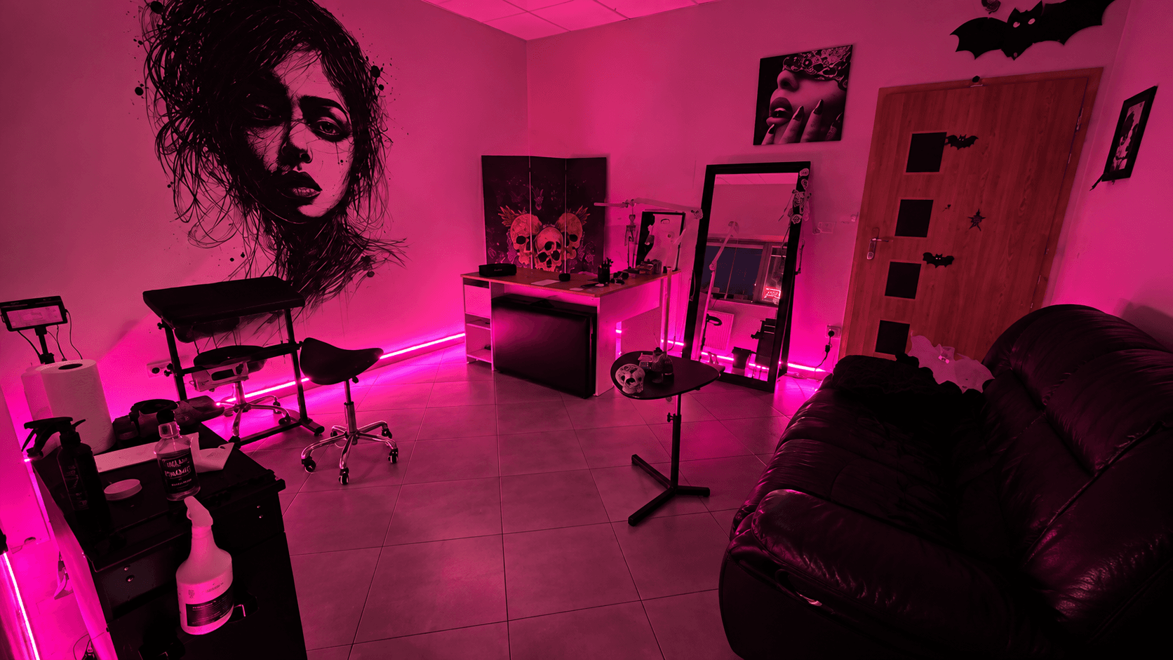 Interior of Black Stroke tattoo studio at Pawia 4 in Gdańsk with Mariana Tkachuk's hand-painted mural